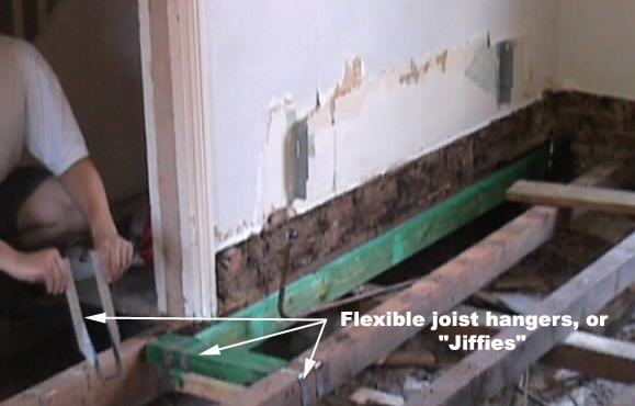 Flexible joist hangers and new timber added under wall